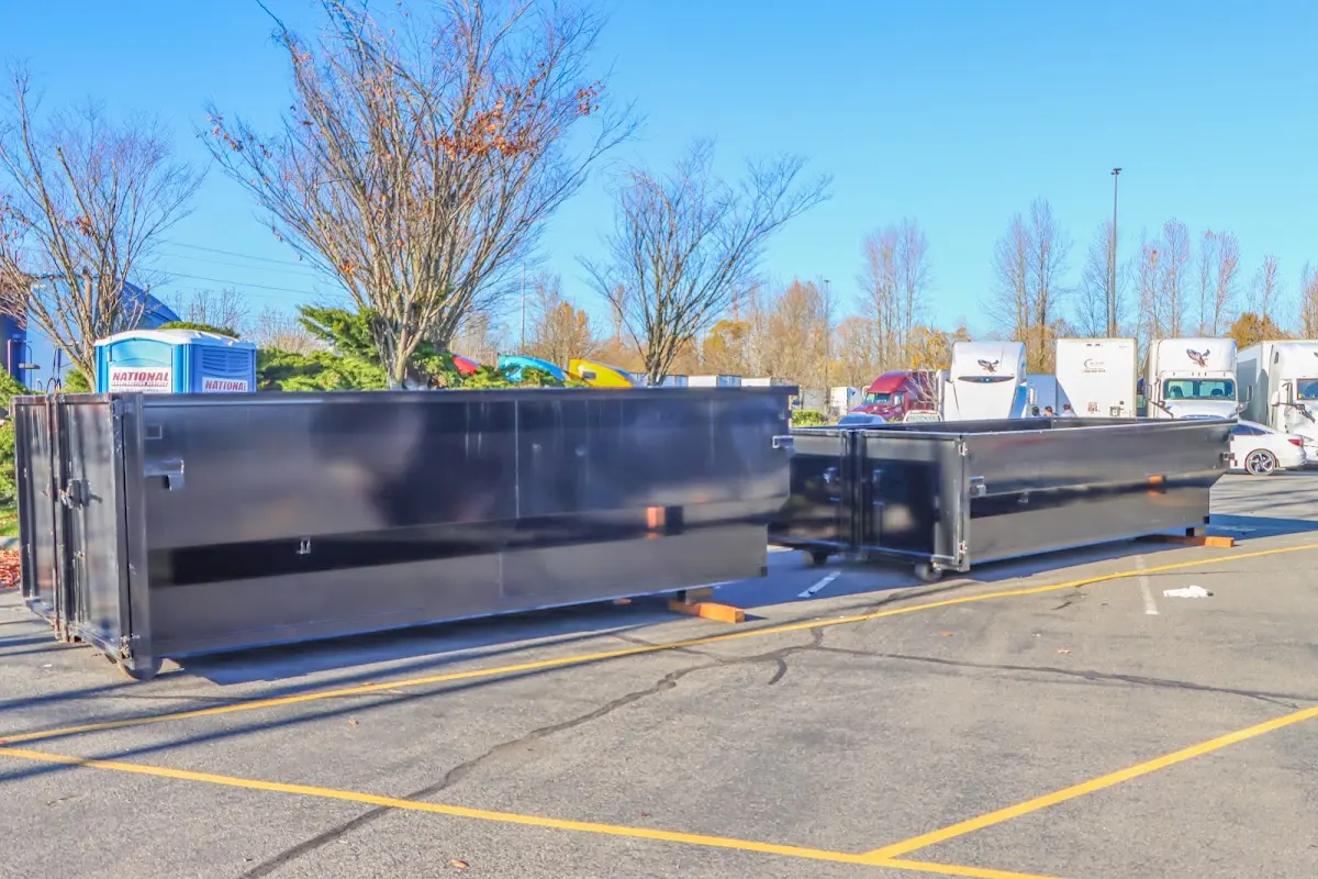 Professional dumpster rental service with roll-off container on residential driveway in Arroyo Grande